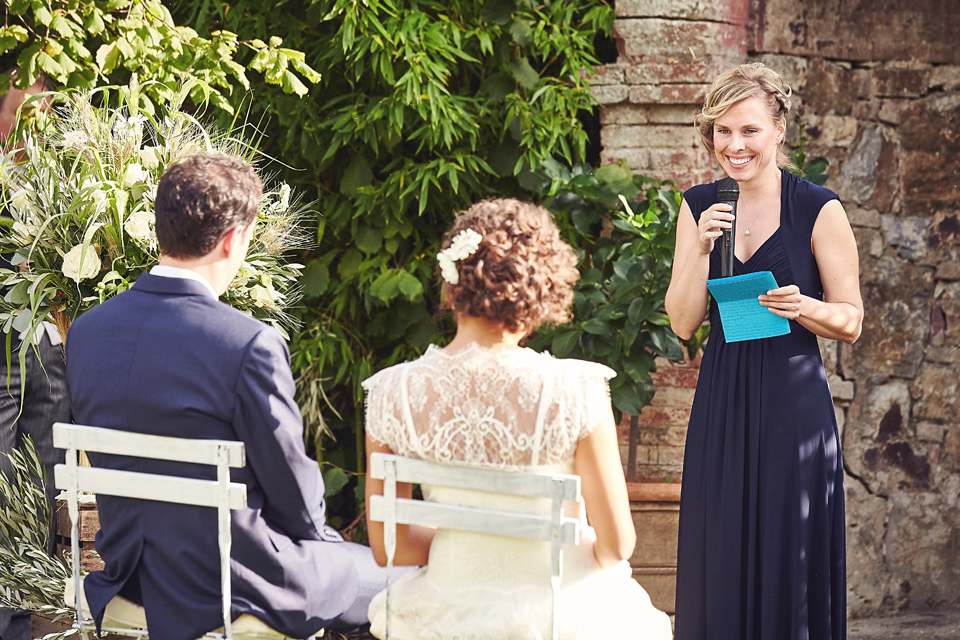 A short, lace, Rembo Styling wedding dress and shades of navy blue for a garden blessing in Tuscany. Photography by Jules Bower.