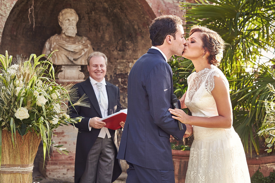 A short, lace, Rembo Styling wedding dress and shades of navy blue for a garden blessing in Tuscany. Photography by Jules Bower.