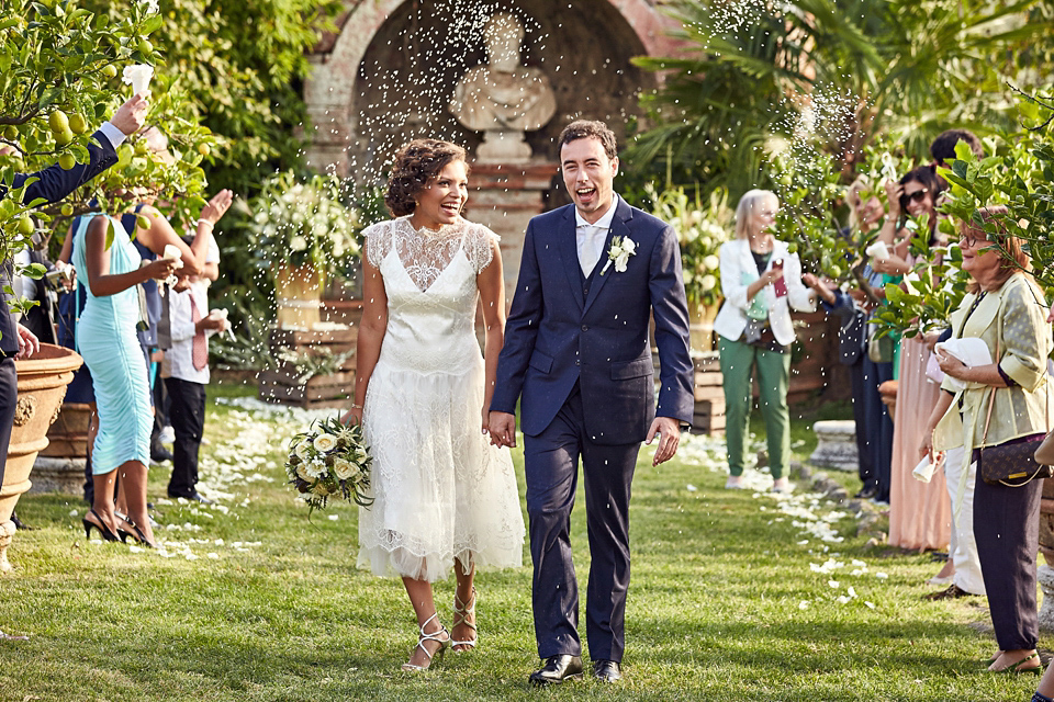 A short, lace, Rembo Styling wedding dress and shades of navy blue for a garden blessing in Tuscany. Photography by Jules Bower.