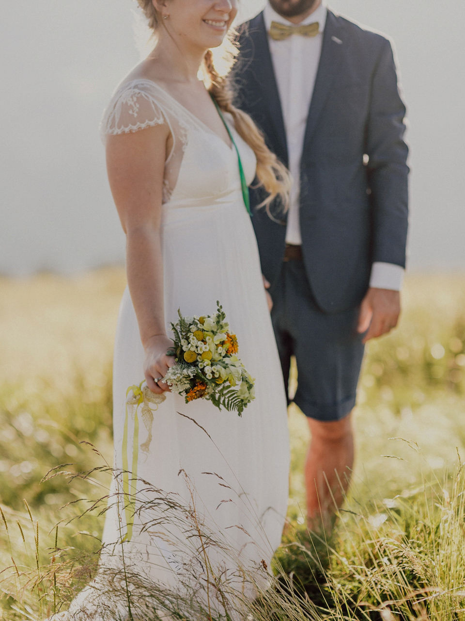 A Swiss mountain elopement. The bride wears a Stephanie Wolff gown. Photography by Capyture.