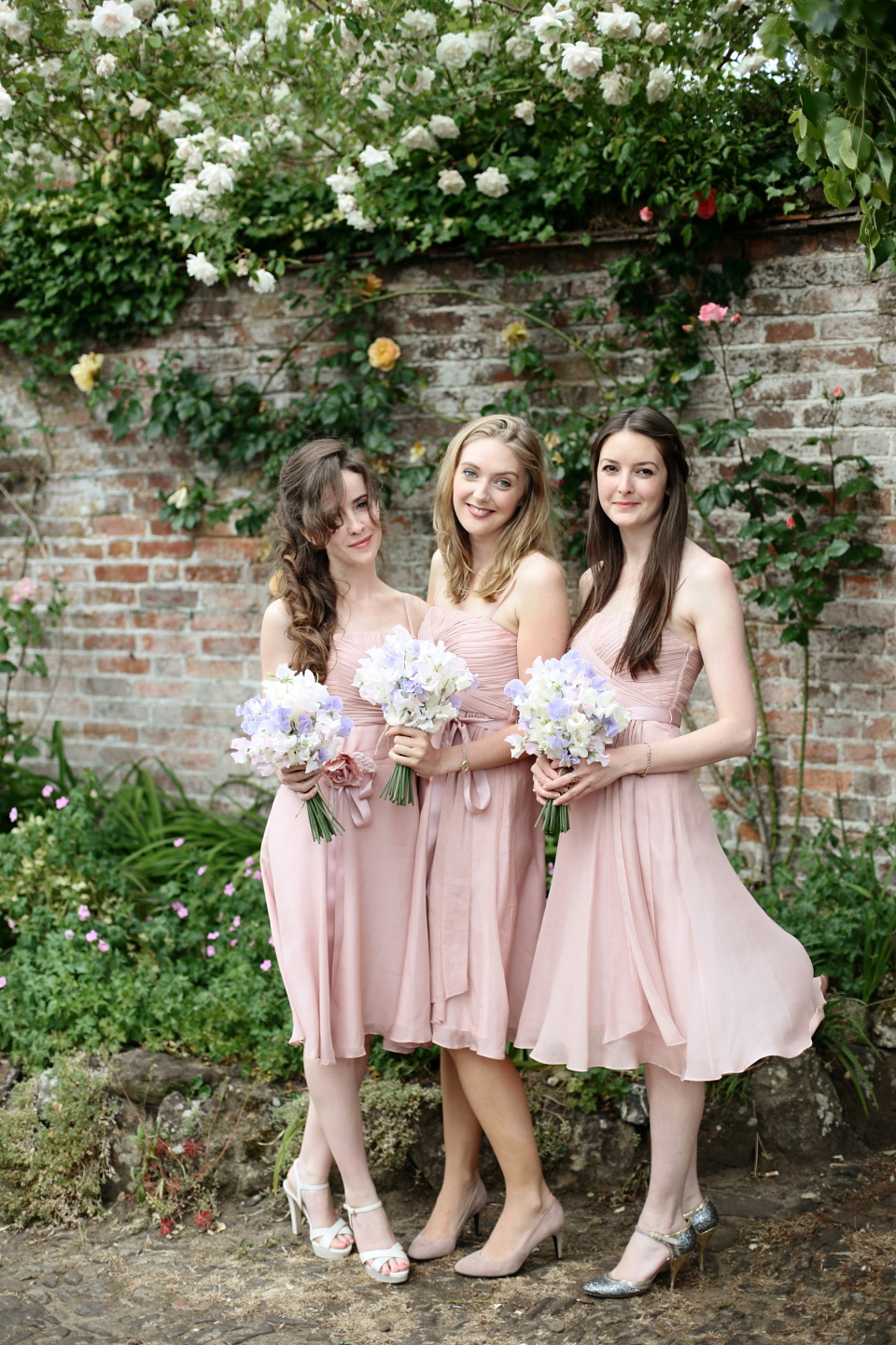 Bride Chloe wore a Suzanne Neville gown which she purchased from Miss Bush Bridal in Surrey, for her military style wedding in the English countryside. Photography by Dasha Caffrey.