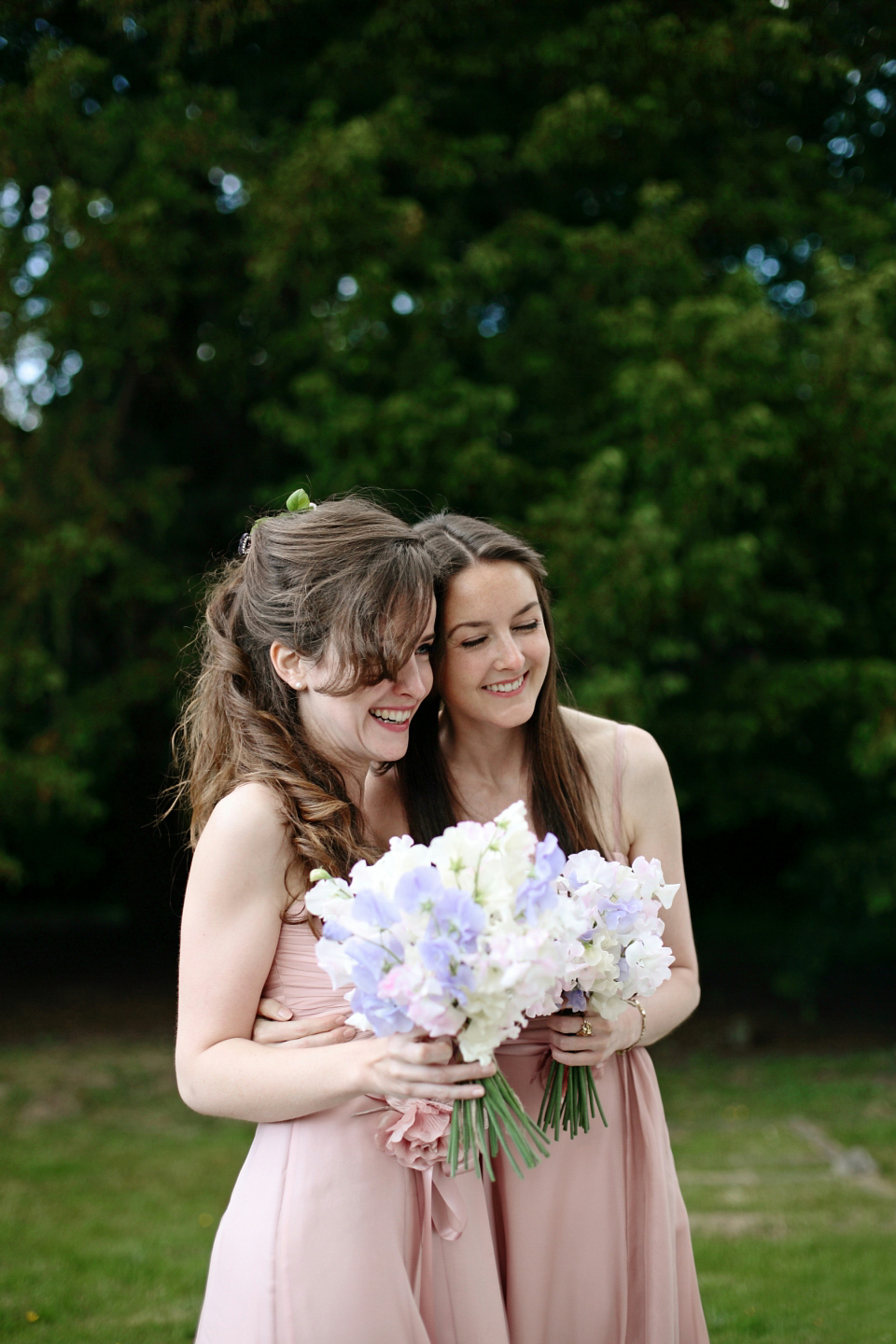 Bride Chloe wore a Suzanne Neville gown which she purchased from Miss Bush Bridal in Surrey, for her military style wedding in the English countryside. Photography by Dasha Caffrey.