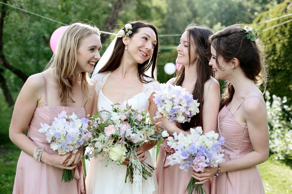 Bride Chloe wore a Suzanne Neville gown which she purchased from Miss Bush Bridal in Surrey, for her military style wedding in the English countryside. Photography by Dasha Caffrey.