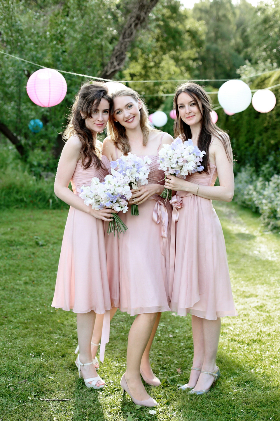 Bride Chloe wore a Suzanne Neville gown which she purchased from Miss Bush Bridal in Surrey, for her military style wedding in the English countryside. Photography by Dasha Caffrey.