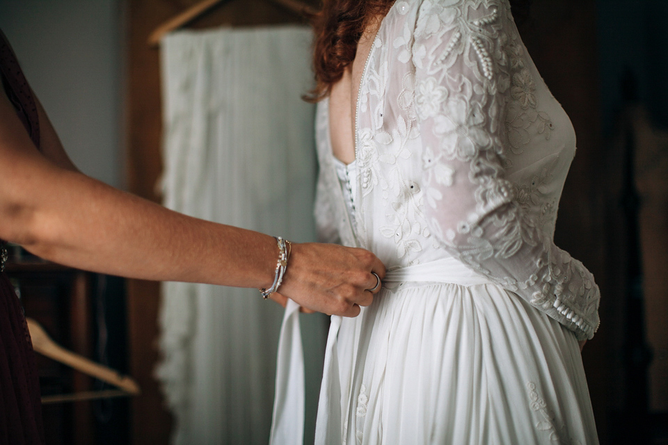 The bride wears an Edwardian inspired wedding dress for her homespun pub wedding. Images by Green Antlers Photography.