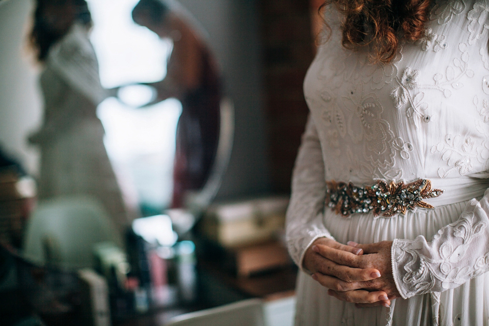 The bride wears an Edwardian inspired wedding dress for her homespun pub wedding. Images by Green Antlers Photography.