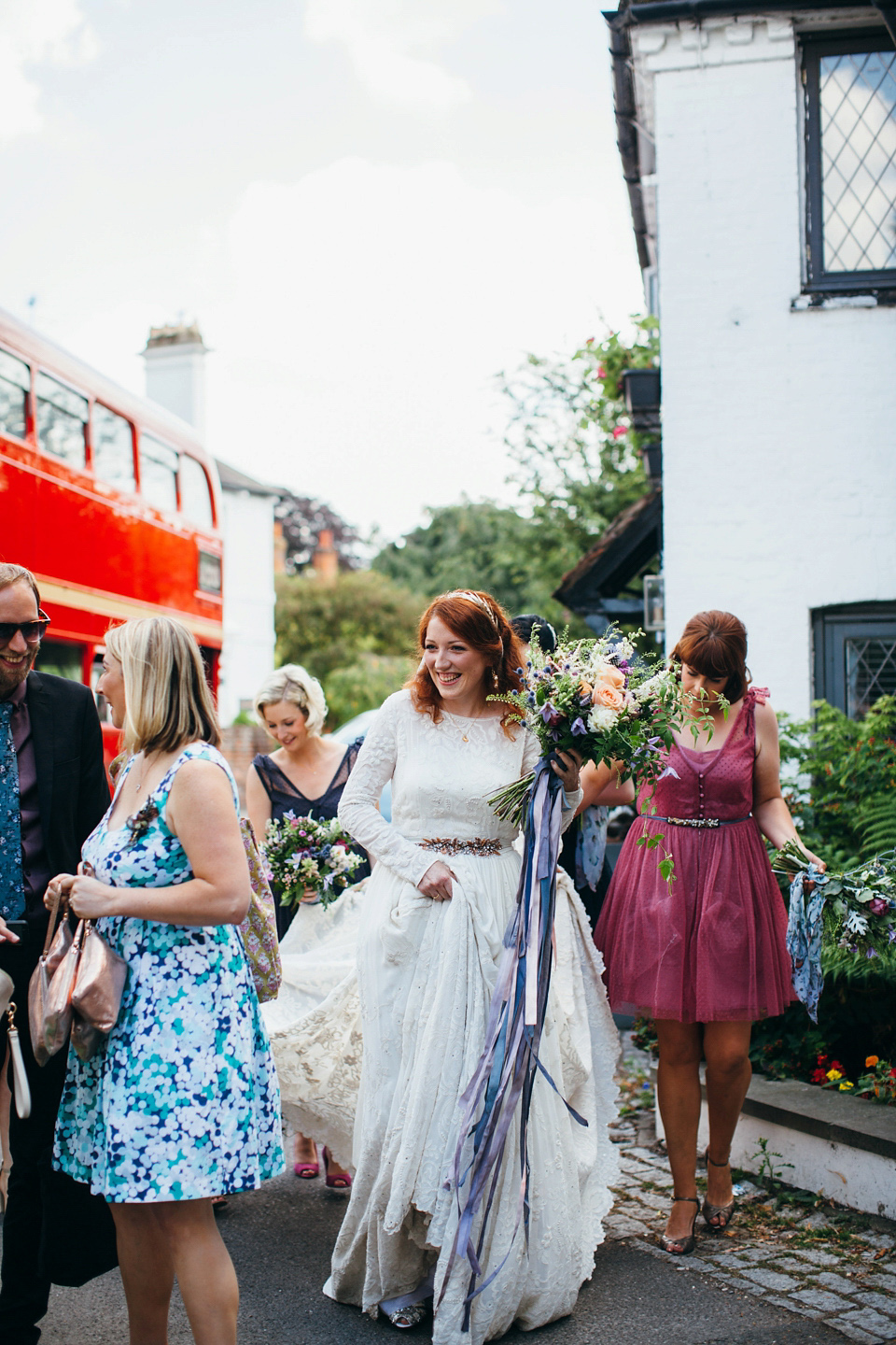 The bride wears an Edwardian inspired wedding dress for her homespun pub wedding. Images by Green Antlers Photography.