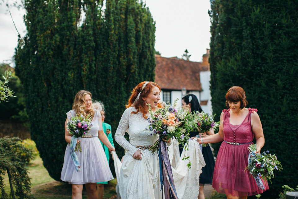 The bride wears an Edwardian inspired wedding dress for her homespun pub wedding. Images by Green Antlers Photography.