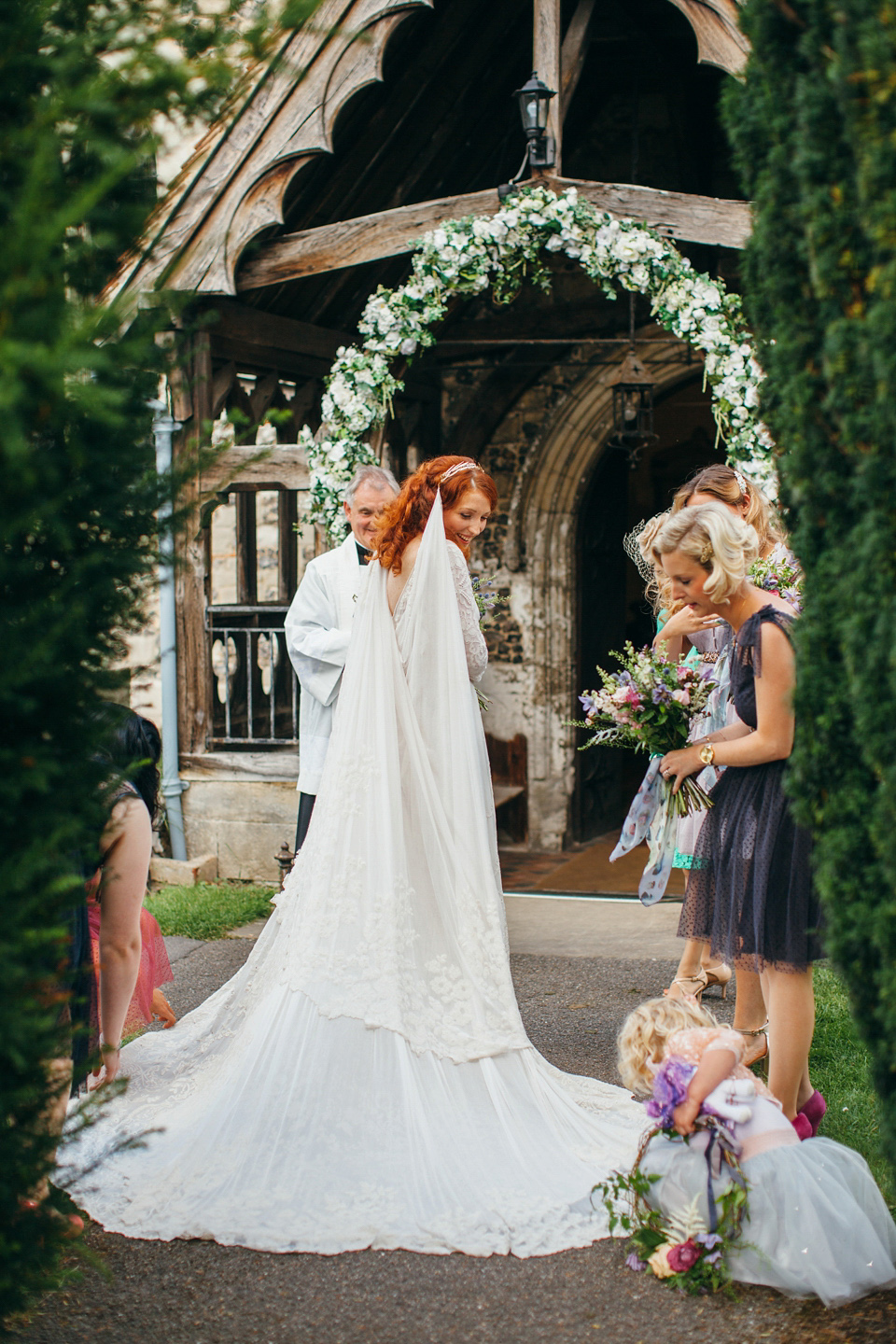 The bride wears an Edwardian inspired wedding dress for her homespun pub wedding. Images by Green Antlers Photography.