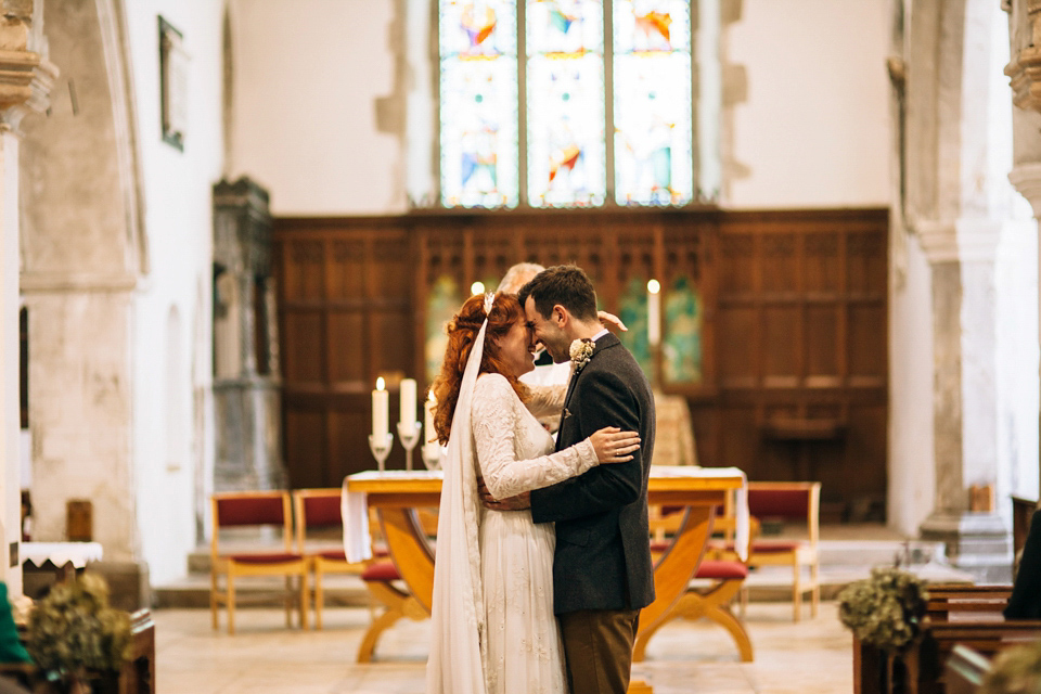 The bride wears an Edwardian inspired wedding dress for her homespun pub wedding. Images by Green Antlers Photography.