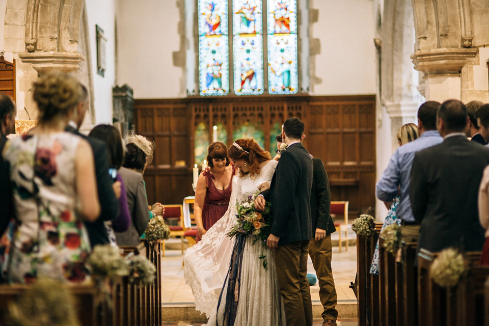 The bride wears an Edwardian inspired wedding dress for her homespun pub wedding. Images by Green Antlers Photography.