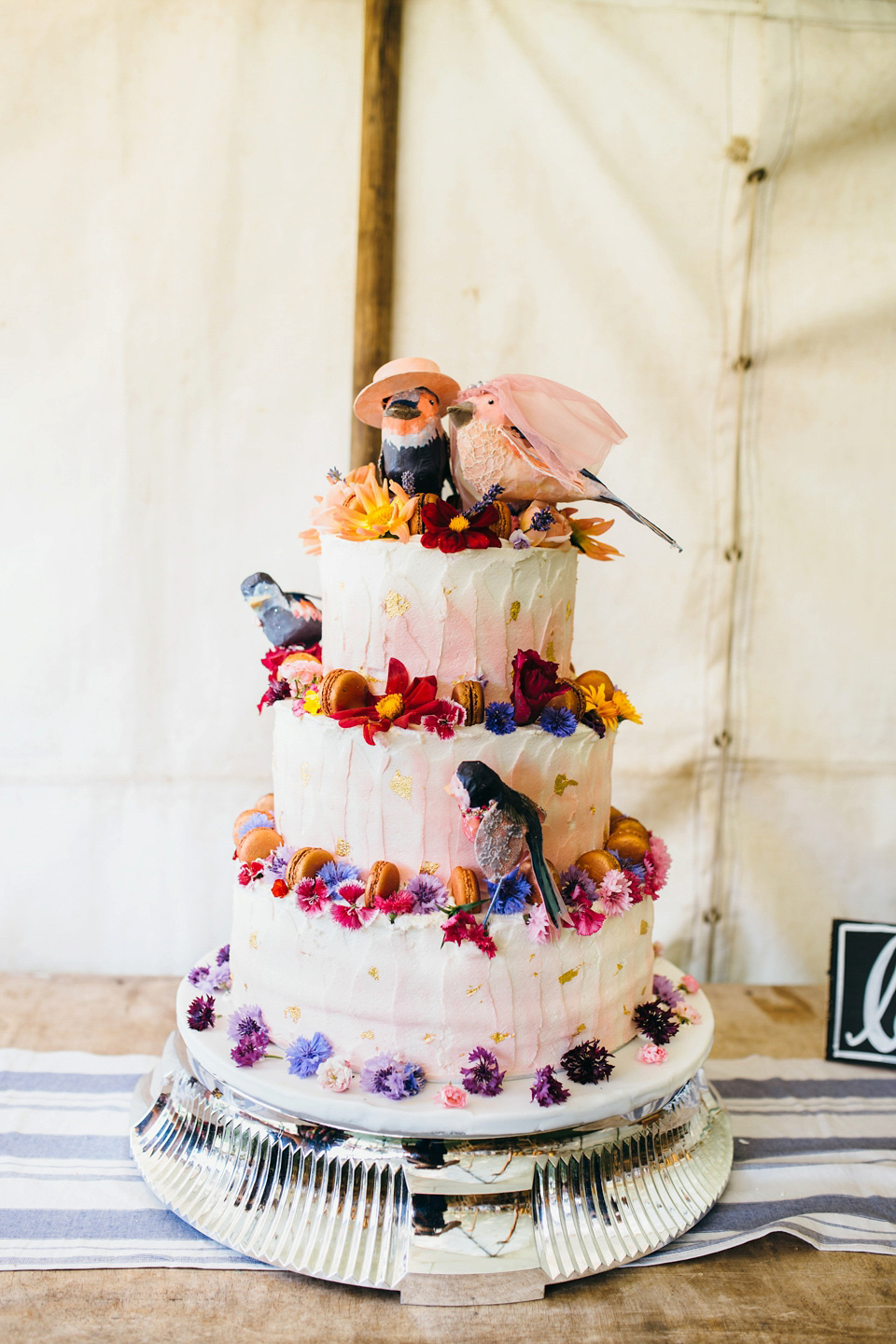 The bride wears an Edwardian inspired wedding dress for her homespun pub wedding. Images by Green Antlers Photography.