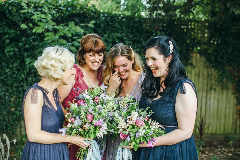 The bride wears an Edwardian inspired wedding dress for her homespun pub wedding. Images by Green Antlers Photography.