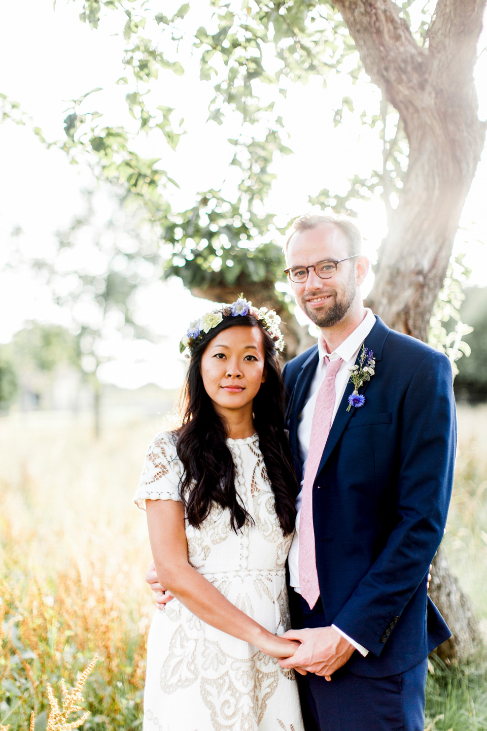 Jenny wore a 'Lost in Paris' gown, created from vintage French lace, for her spiritual and homespun wedding held at Court Farm in Somerset. Photography by Kerry Bartlett