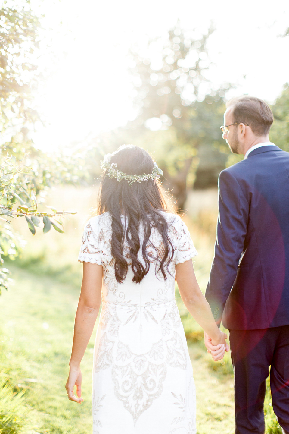 Jenny wore a 'Lost in Paris' gown, created from vintage French lace, for her spiritual and homespun wedding held at Court Farm in Somerset. Photography by Kerry Bartlett