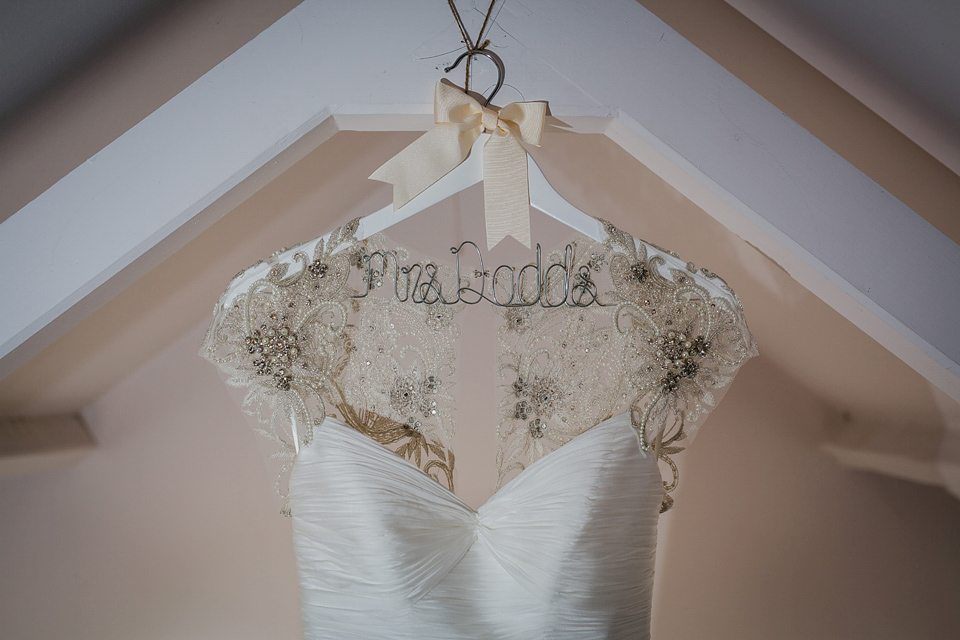 A Suzanne Neville gown and shades fo pink for a colourful wedding at Healey Barn, Northumberland. Photography by John Hope.