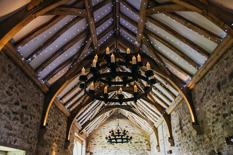 A Suzanne Neville gown and shades fo pink for a colourful wedding at Healey Barn, Northumberland. Photography by John Hope.