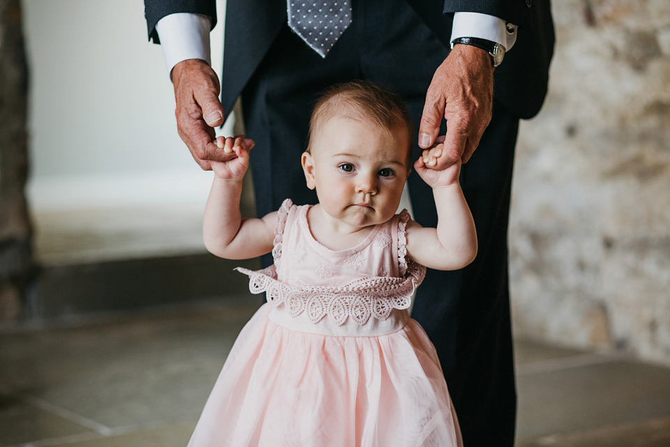 A Suzanne Neville gown and shades fo pink for a colourful wedding at Healey Barn, Northumberland. Photography by John Hope.