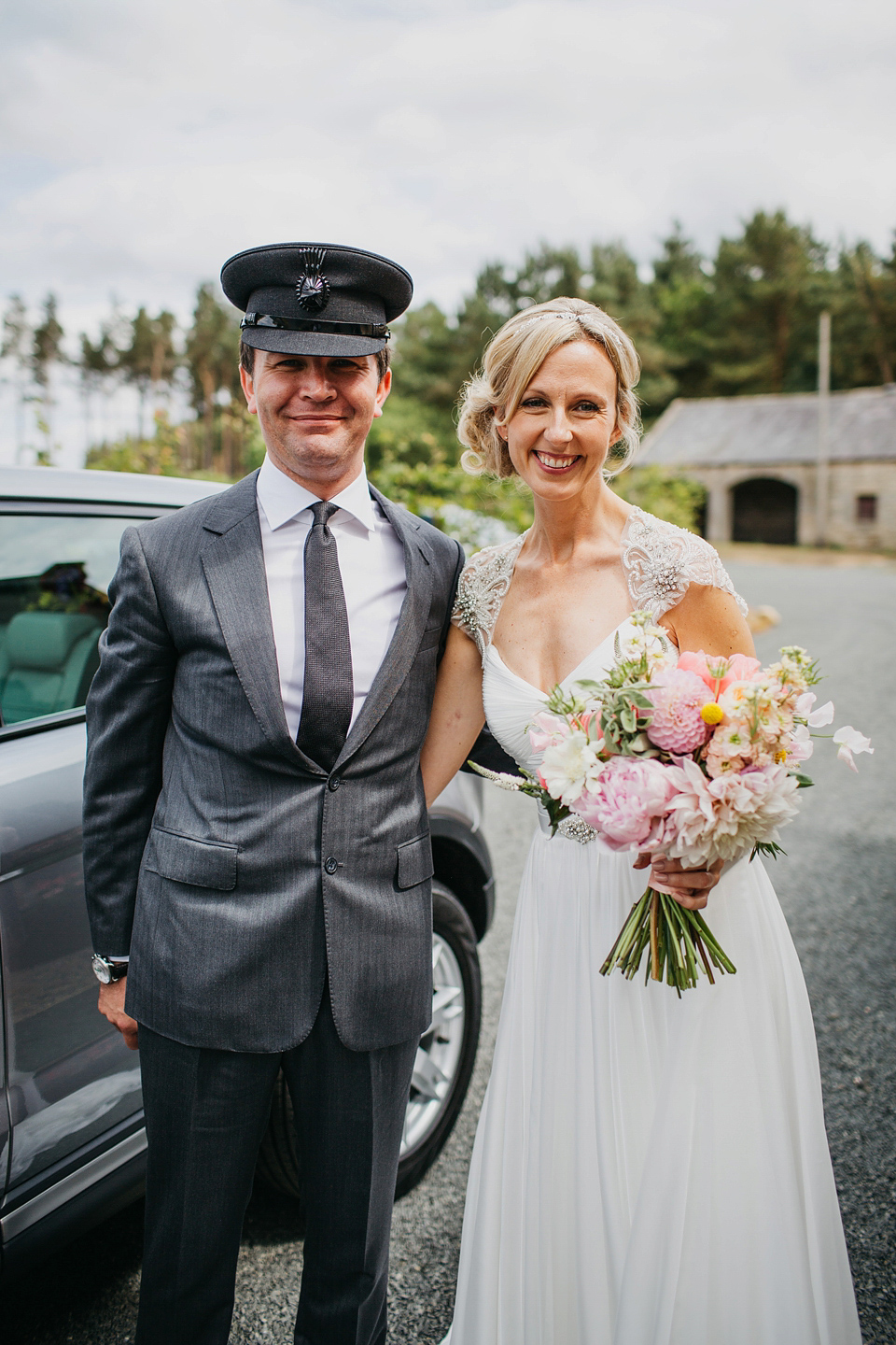 A Suzanne Neville gown and shades fo pink for a colourful wedding at Healey Barn, Northumberland. Photography by John Hope.