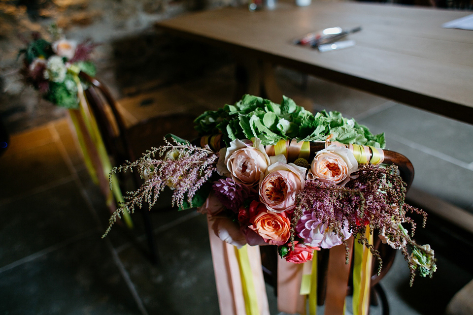 A Suzanne Neville gown and shades fo pink for a colourful wedding at Healey Barn, Northumberland. Photography by John Hope.