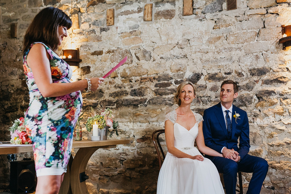 A Suzanne Neville gown and shades fo pink for a colourful wedding at Healey Barn, Northumberland. Photography by John Hope.