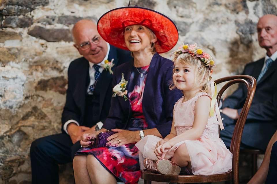 A Suzanne Neville gown and shades fo pink for a colourful wedding at Healey Barn, Northumberland. Photography by John Hope.
