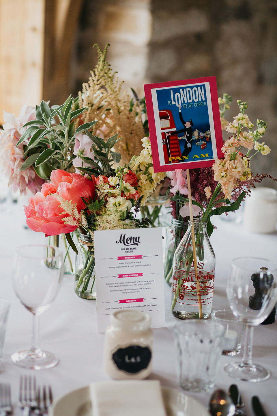 A Suzanne Neville gown and shades fo pink for a colourful wedding at Healey Barn, Northumberland. Photography by John Hope.