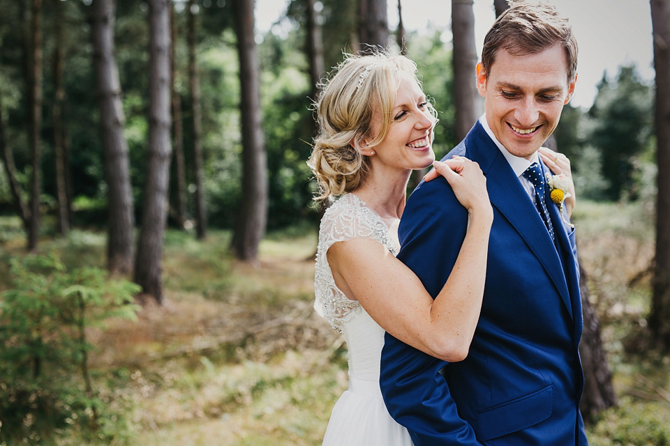 A Suzanne Neville gown and shades fo pink for a colourful wedding at Healey Barn, Northumberland. Photography by John Hope.