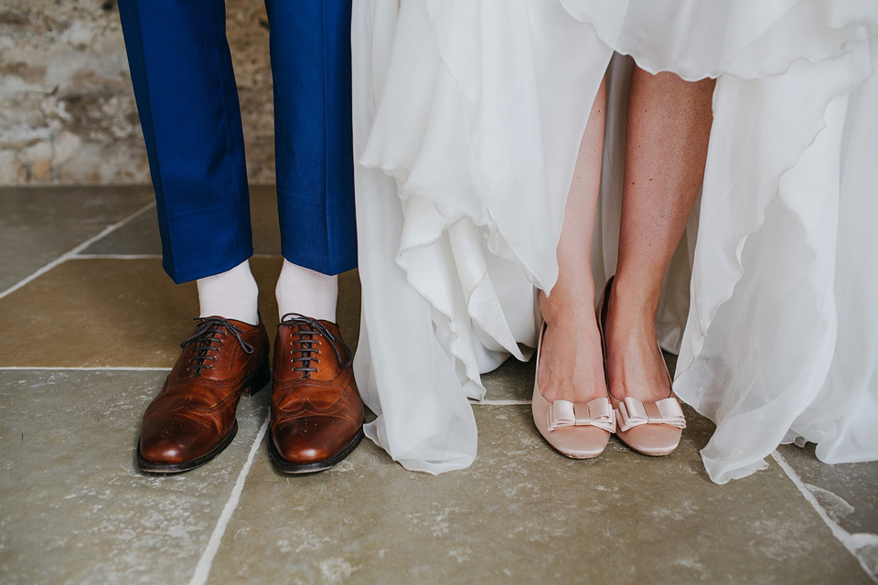 A Suzanne Neville gown and shades fo pink for a colourful wedding at Healey Barn, Northumberland. Photography by John Hope.