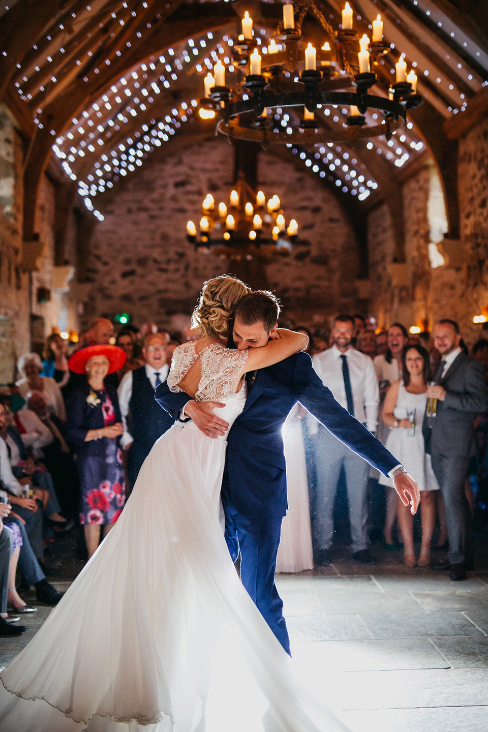 A Suzanne Neville gown and shades fo pink for a colourful wedding at Healey Barn, Northumberland. Photography by John Hope.