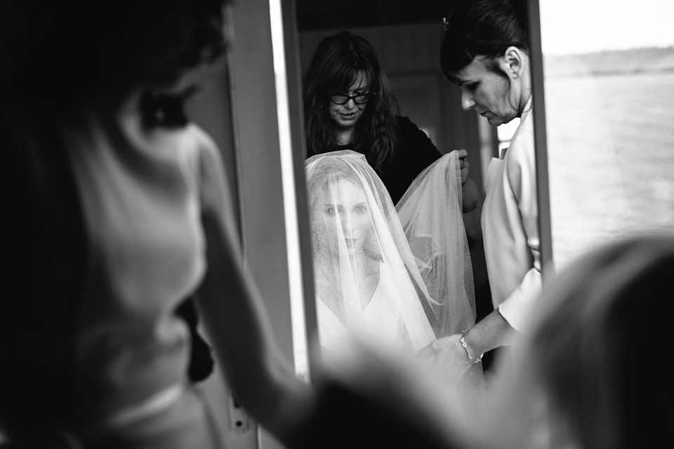 Lauren wears an original vintage 1940s wedding dress and veil for her elegant and colourful wedding at Crear in Scotland. Photography by Caro Weiss.