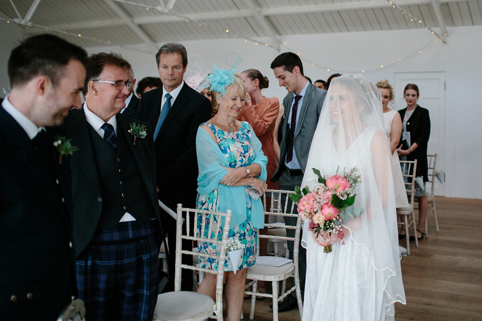 Lauren wears an original vintage 1940s wedding dress and veil for her elegant and colourful wedding at Crear in Scotland. Photography by Caro Weiss. Lauren wears an original vintage 1940s wedding dress and veil for her elegant and colourful wedding at Crear in Scotland. Photography by Caro Weiss.