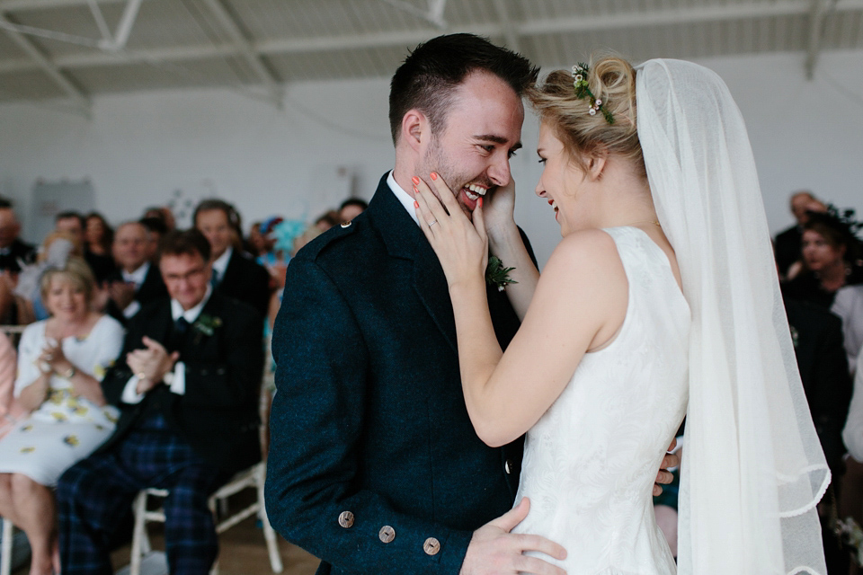 Lauren wears an original vintage 1940s wedding dress and veil for her elegant and colourful wedding at Crear in Scotland. Photography by Caro Weiss.