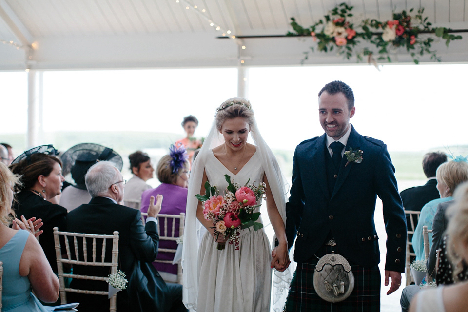 Lauren wears an original vintage 1940s wedding dress and veil for her elegant and colourful wedding at Crear in Scotland. Photography by Caro Weiss. Lauren wears an original vintage 1940s wedding dress and veil for her elegant and colourful wedding at Crear in Scotland. Photography by Caro Weiss.