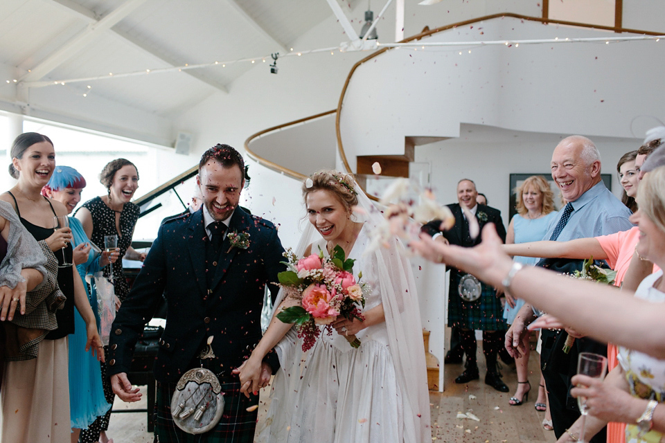 Lauren wears an original vintage 1940s wedding dress and veil for her elegant and colourful wedding at Crear in Scotland. Photography by Caro Weiss.