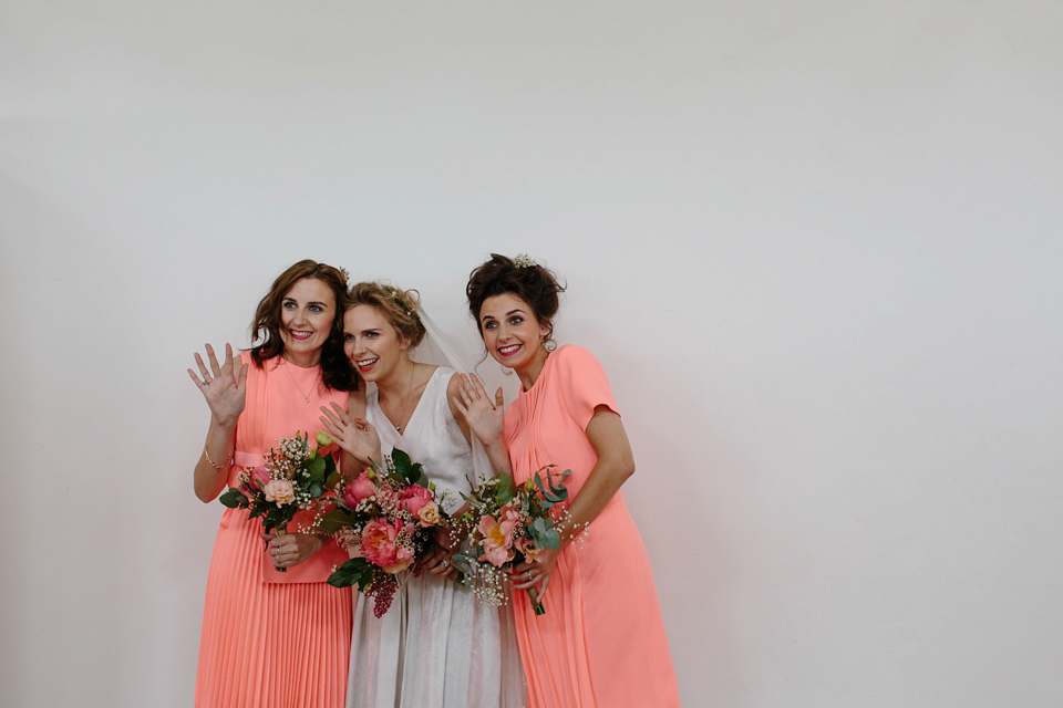 Lauren wears an original vintage 1940s wedding dress and veil for her elegant and colourful wedding at Crear in Scotland. Photography by Caro Weiss.