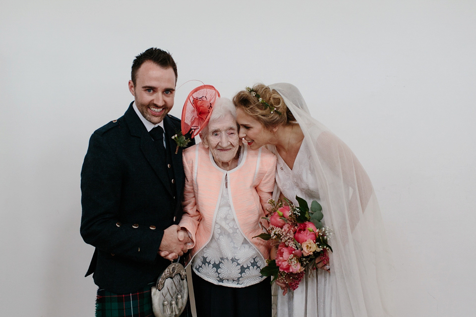 Lauren wears an original vintage 1940s wedding dress and veil for her elegant and colourful wedding at Crear in Scotland. Photography by Caro Weiss.