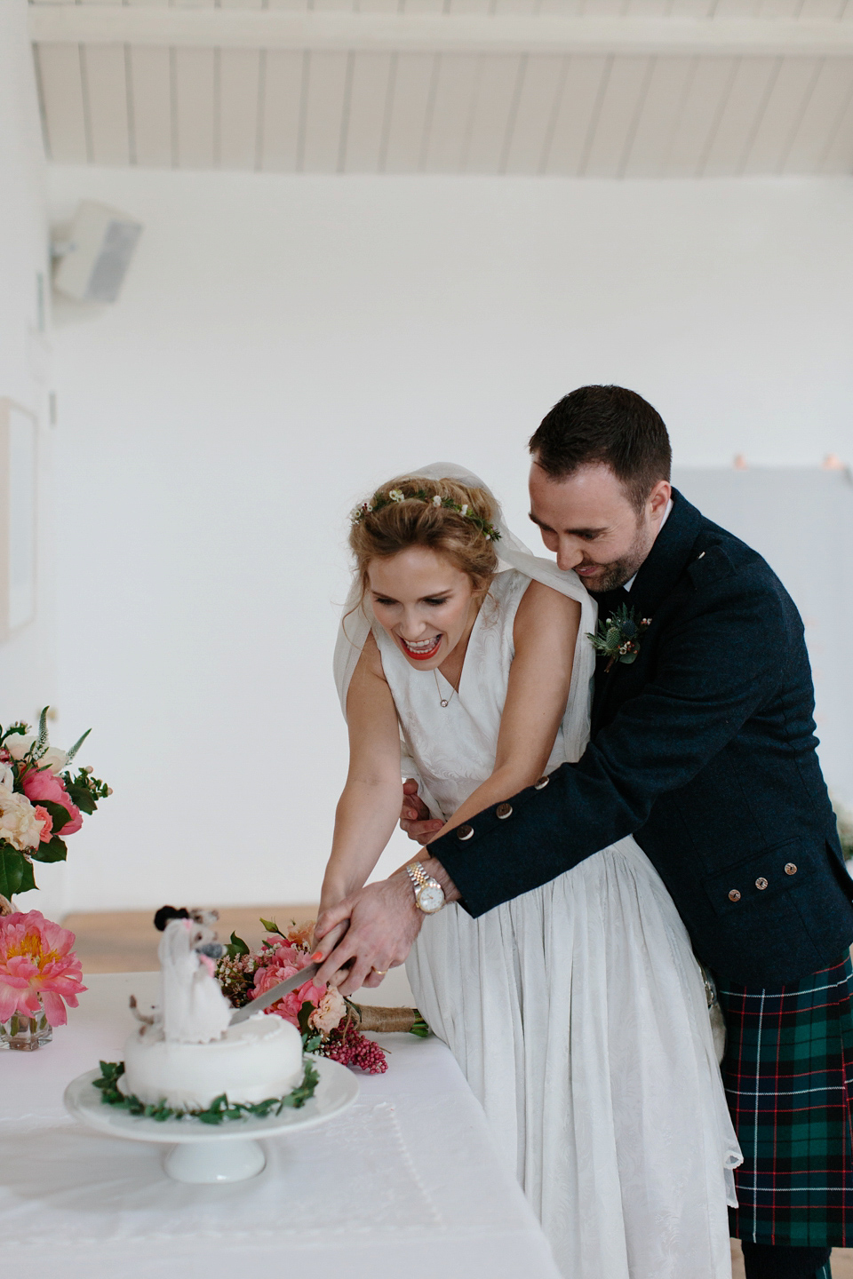 Lauren wears an original vintage 1940s wedding dress and veil for her elegant and colourful wedding at Crear in Scotland. Photography by Caro Weiss.