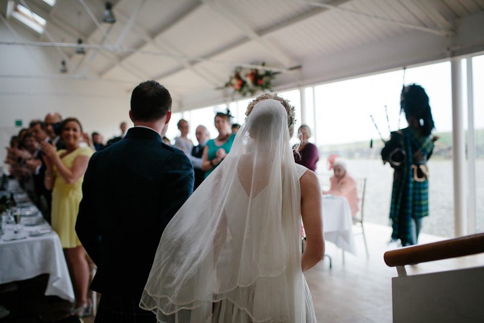 Lauren wears an original vintage 1940s wedding dress and veil for her elegant and colourful wedding at Crear in Scotland. Photography by Caro Weiss.