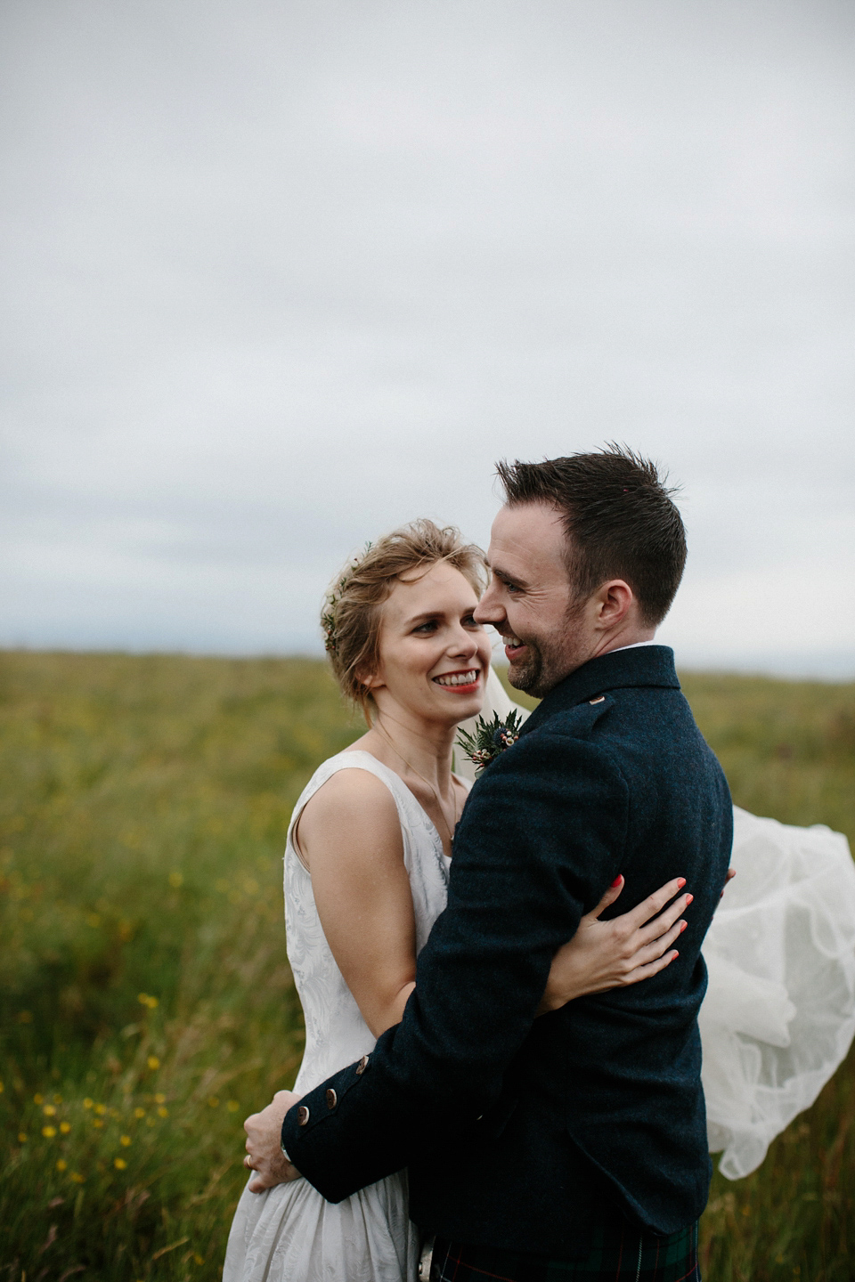 Lauren wears an original vintage 1940s wedding dress and veil for her elegant and colourful wedding at Crear in Scotland. Photography by Caro Weiss.