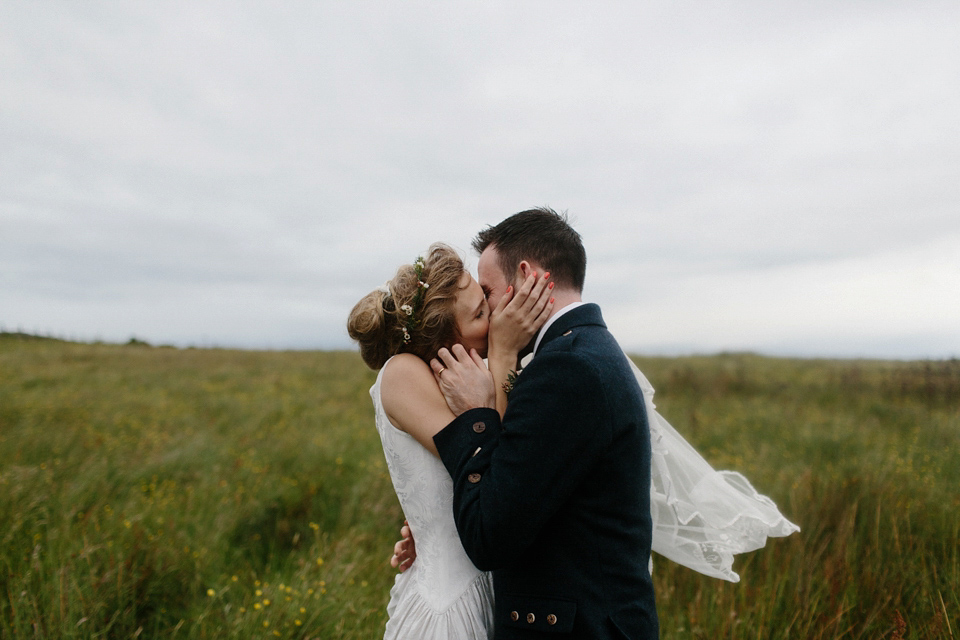 Lauren wears an original vintage 1940s wedding dress and veil for her elegant and colourful wedding at Crear in Scotland. Photography by Caro Weiss.