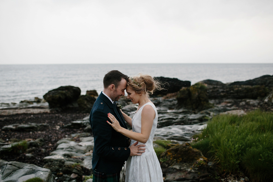 Lauren wears an original vintage 1940s wedding dress and veil for her elegant and colourful wedding at Crear in Scotland. Photography by Caro Weiss.