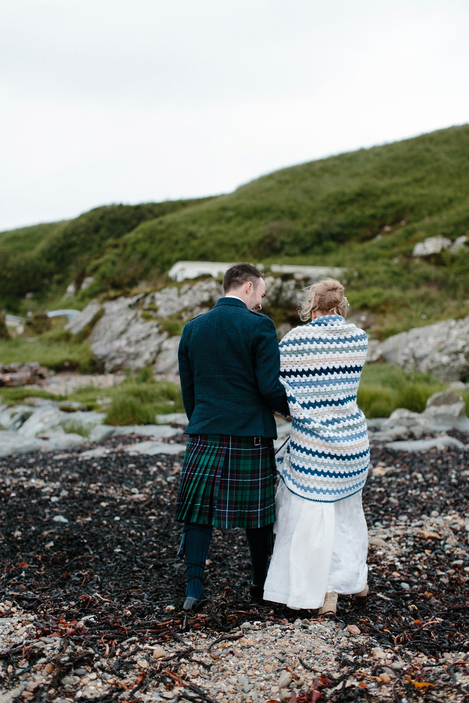 Lauren wears an original vintage 1940s wedding dress and veil for her elegant and colourful wedding at Crear in Scotland. Photography by Caro Weiss.