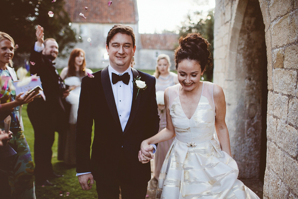 Bride Jennifer wears a gold Lela Rose wedding dress for her Roman Baths wedding. Her maids wear Rachel Gilbert. Images by A Thing Like That Photography.