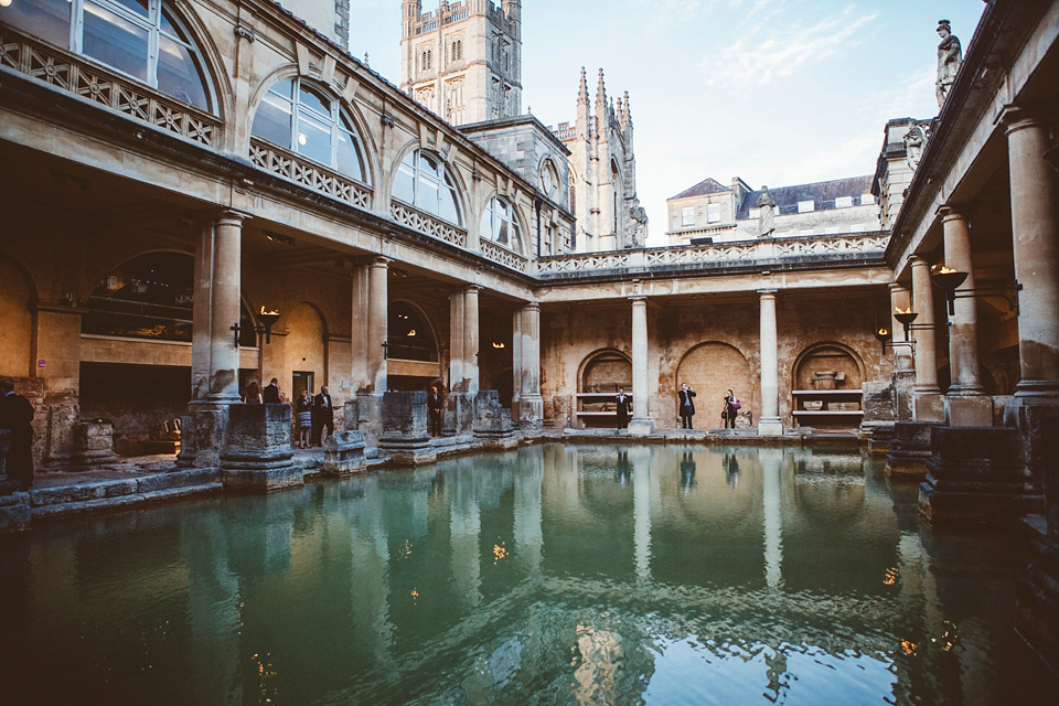 Bride Jennifer wears a gold Lela Rose wedding dress for her Roman Baths wedding. Her maids wear Rachel Gilbert. Images by A Thing Like That Photography.