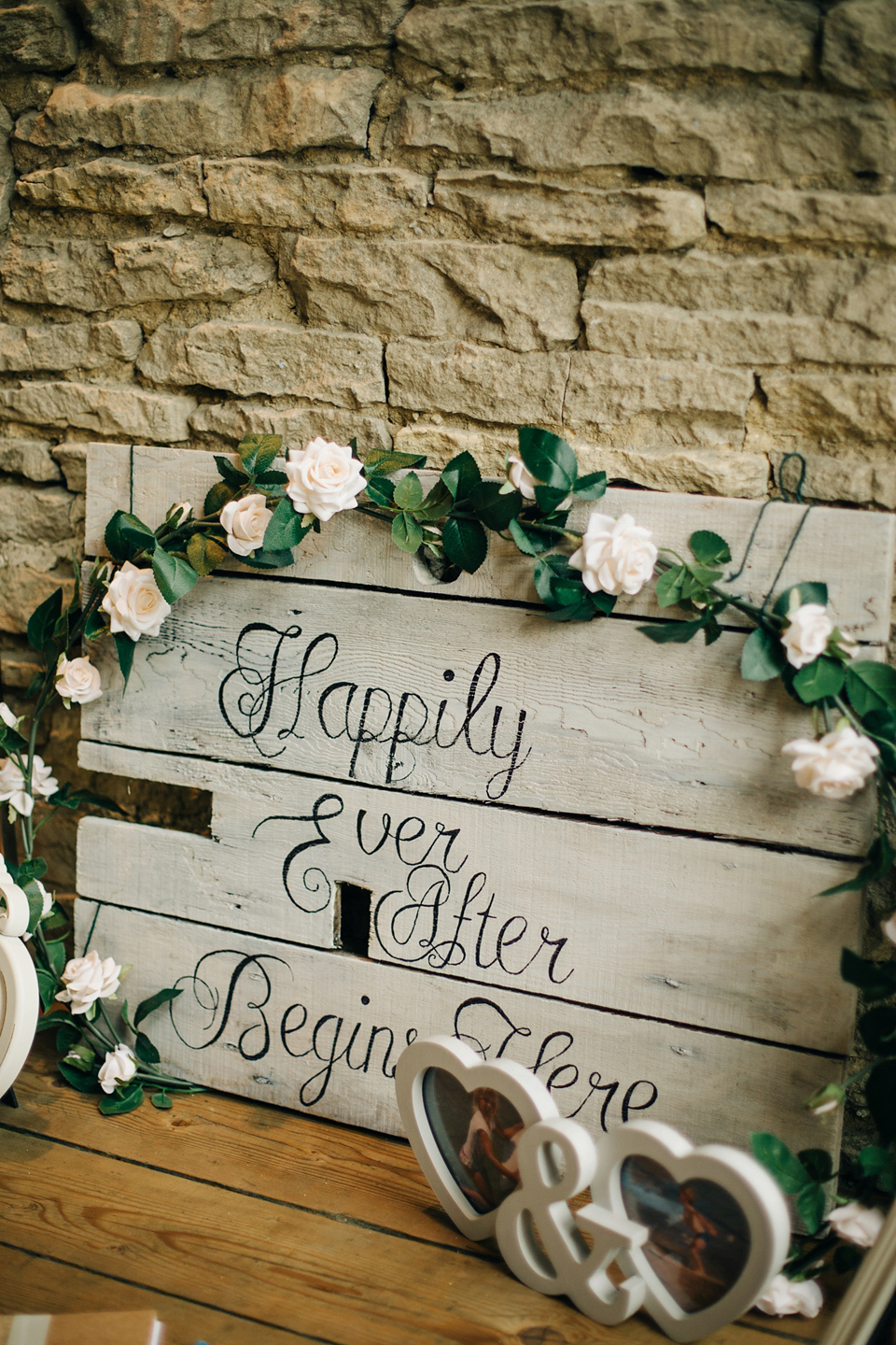 Bride Melanie wears the 'fleur' gown by Naomi Neoh for her Cripps Barn wedding. Her bridesmaids are most pretty in soft pink by 'For Her & For Him'. Images by M&J Photography.