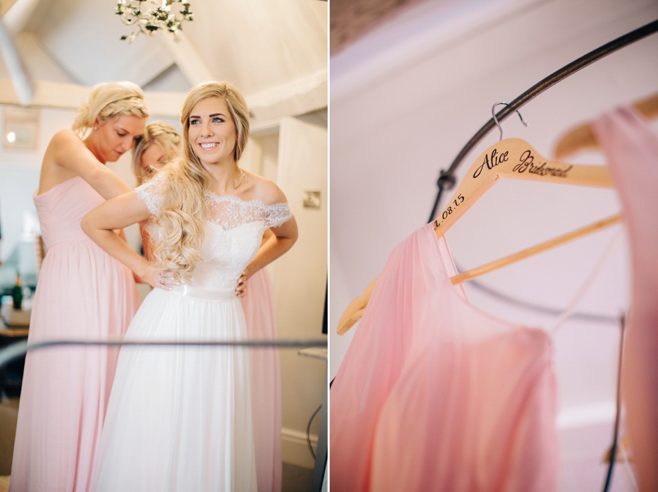 Bride Melanie wears the 'fleur' gown by Naomi Neoh for her Cripps Barn wedding. Her bridesmaids are most pretty in soft pink by 'For Her & For Him'. Images by M&J Photography.