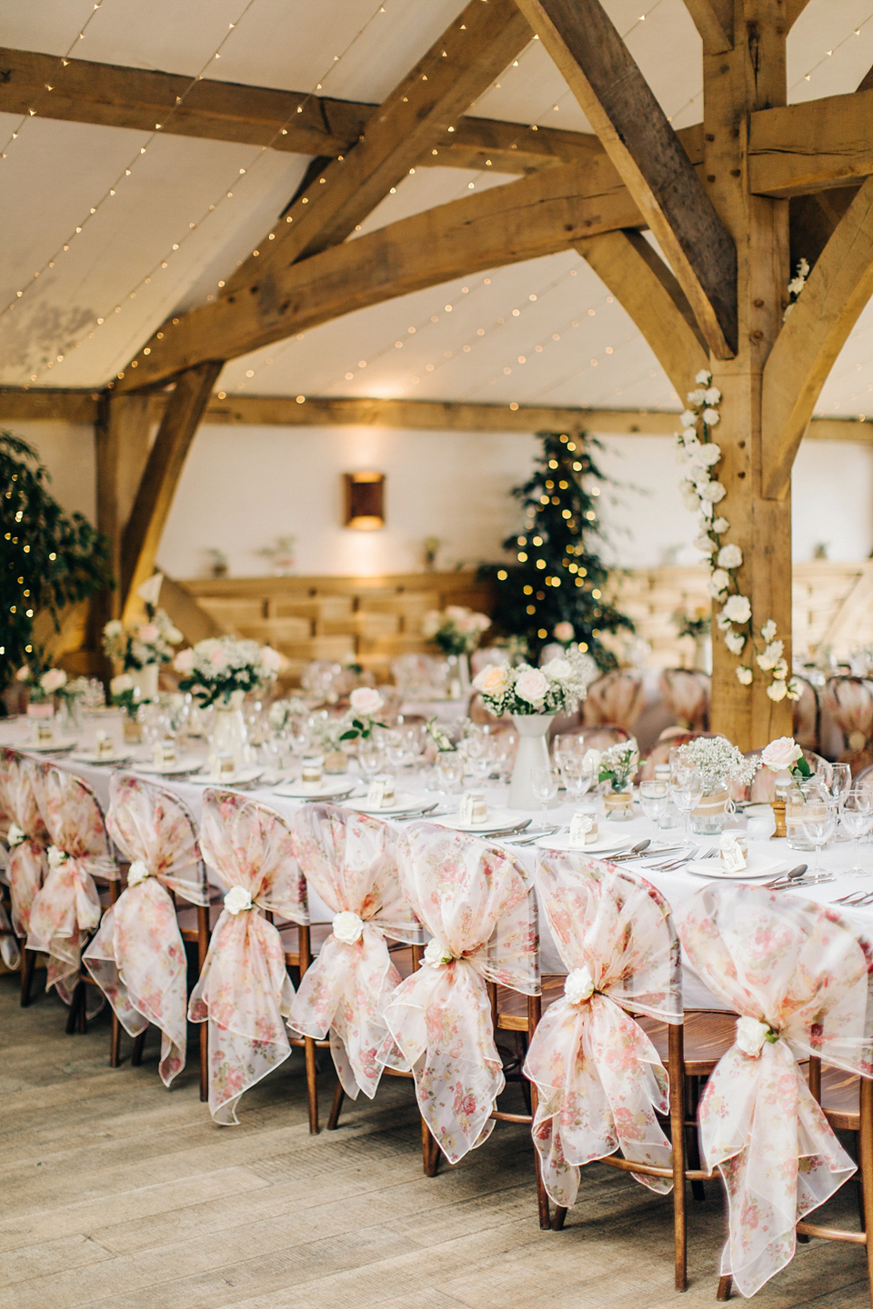 Bride Melanie wears the 'fleur' gown by Naomi Neoh for her Cripps Barn wedding. Her bridesmaids are most pretty in soft pink by 'For Her & For Him'. Images by M&J Photography.