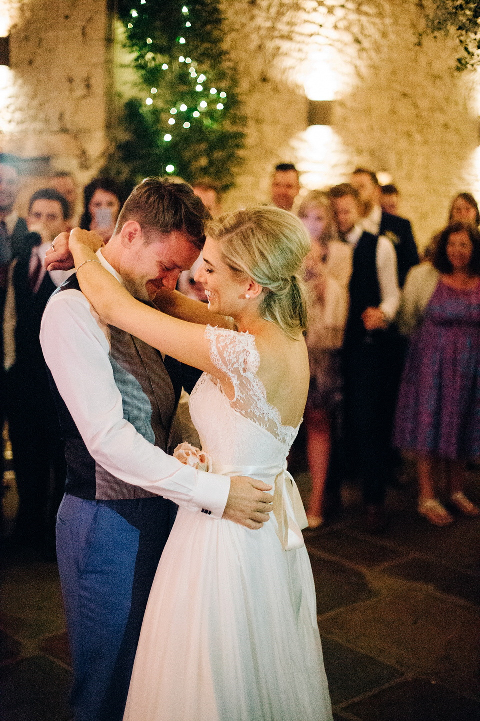 Bride Melanie wears the 'fleur' gown by Naomi Neoh for her Cripps Barn wedding. Her bridesmaids are most pretty in soft pink by 'For Her & For Him'. Images by M&J Photography.