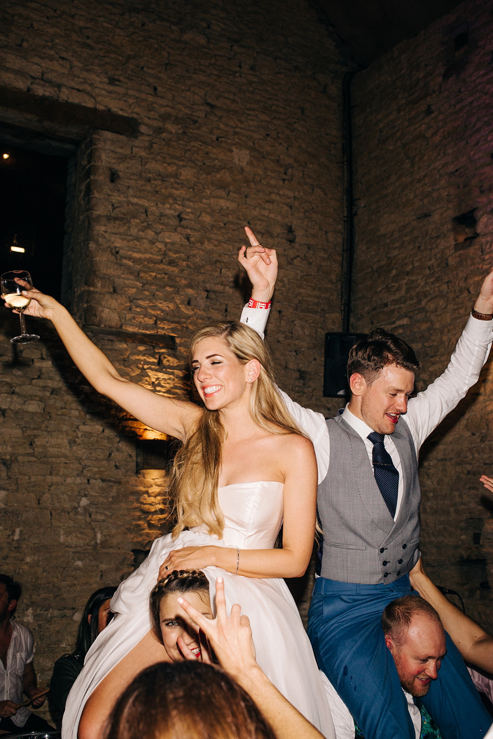 Bride Melanie wears the 'fleur' gown by Naomi Neoh for her Cripps Barn wedding. Her bridesmaids are most pretty in soft pink by 'For Her & For Him'. Images by M&J Photography.